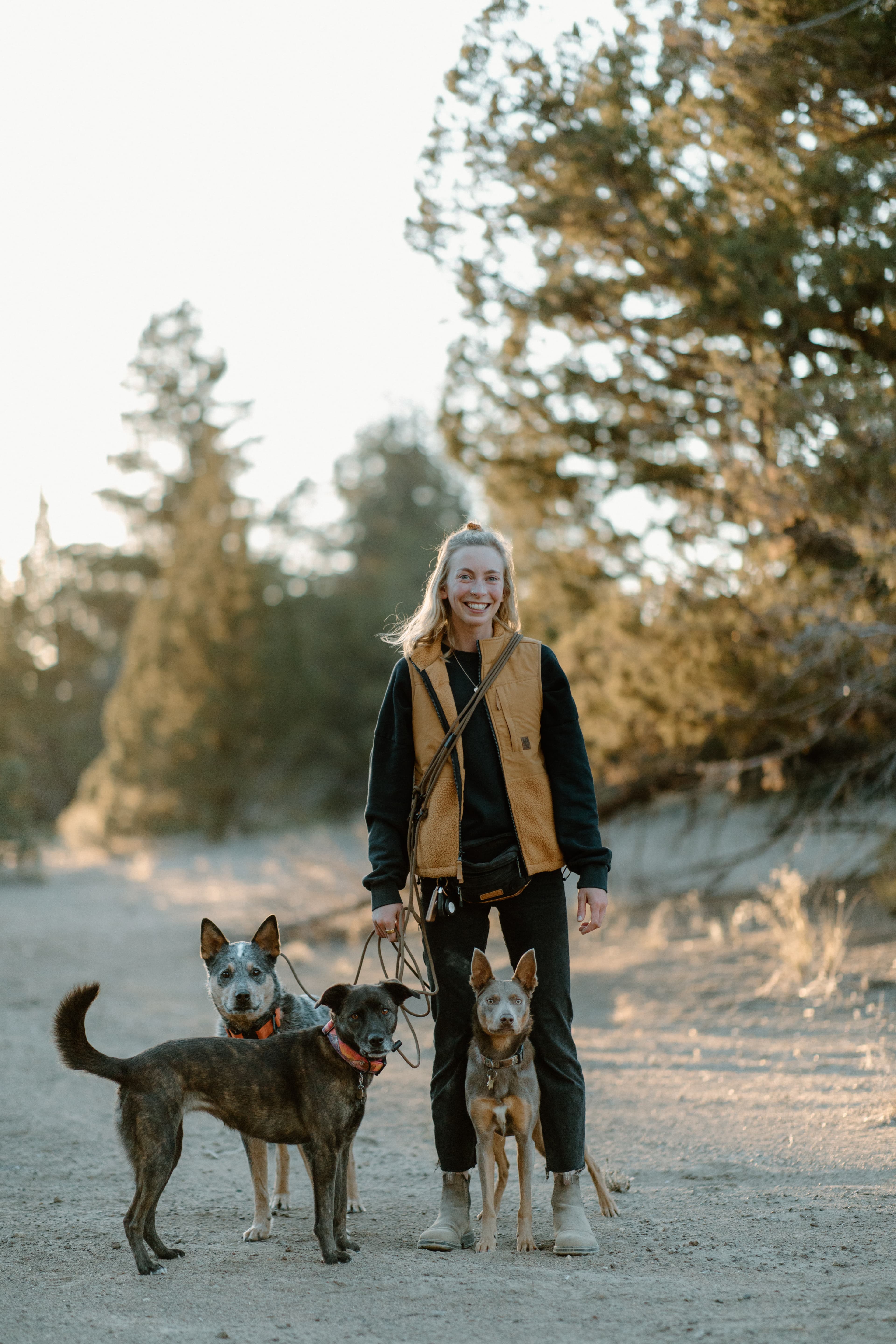 Customer with three dogs wearing Chaotic K9 Creations leashes